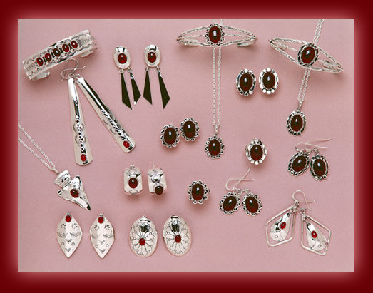 Bracelets, earrings, rings, bolas, pendants, and necklaces made from Red Garnet and Sterling Silver settings.