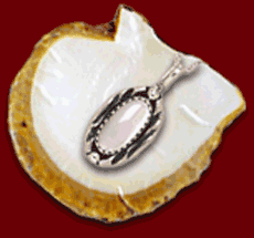 Mother of pearl comes from the inner layer of mollusk and snail shells which produce an iridescent play of color.