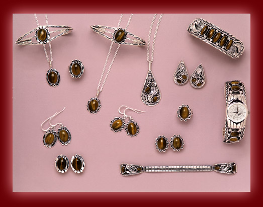 The gemstone Tiger Eye is mounted on silver jewelry settings of pendants, necklaces, earrings, rings, bolas, bracelets, belt buckles, and watch tips.